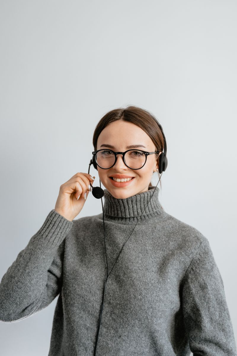 Jordan, front desk team member answering a call on her headset
